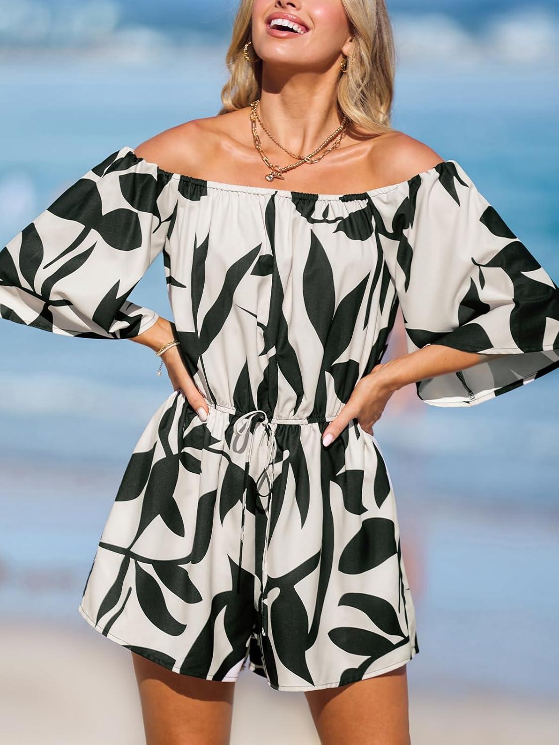 imageCUPSHE Womens Summer Casual 34 Sleeve Romper Wide Leg Floral Tropical Off Shoulder Elastic Waist Jumpsuit with PocketsBlack